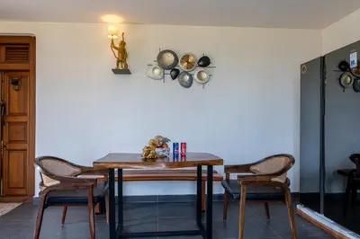 a dining room with a table and chairs at Safari Farms Resorts and Leisure in Kandivalli