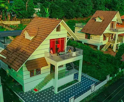 a model of a house with a red door at The NEST VILLAS in Athirappilly