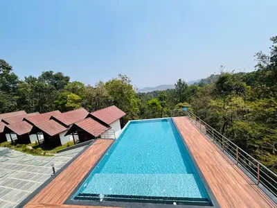 an image of a swimming pool at a resort at FORTUNE BANASURA Resort in Kalpetta