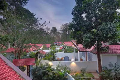 an aerial view of a house with red roofs at Gokulam Grand Resort & Spa, Coorg in Kushālnagar