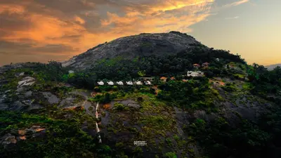 an aerial view of a mountain with houses on it at Mount Xanadu Resorts in Ambalavayal