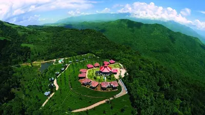 an aerial view of a house in the middle of a mountain at Wild Planet Jungle Resort in Devāla