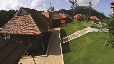an aerial view of a house with a yard at Wild Planet Jungle Resort in Devāla