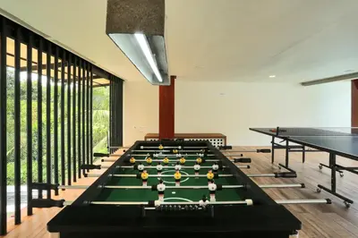 a billiard room with a pool table at Le Villagio Resort & Domes in Sultan Bathery