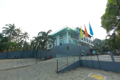 a building with flags on the side of it at Park regency in Angamali