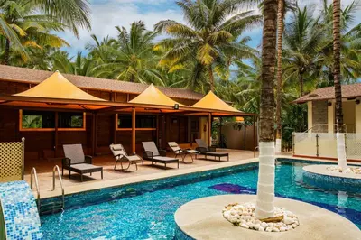 a resort with a swimming pool with a resort at Sterling Anaikatti in Varagampadi