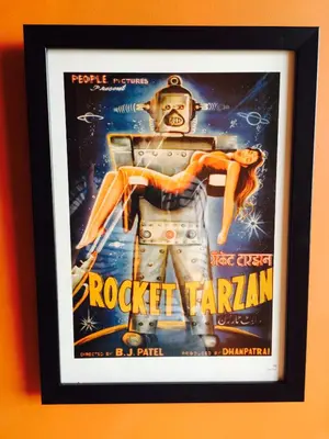 a framed picture of a movie poster for a star wars movie at Majo House in Cherai Beach