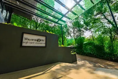 a view of a garden with a sign in a greenhouse at Wayanad Wild - A CGH Earth Experience in Vythiri