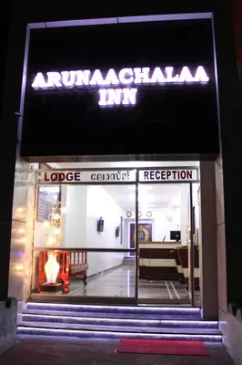 a building with a sign that reads argentinian inn at Arunaachalaa Inn in Palani
