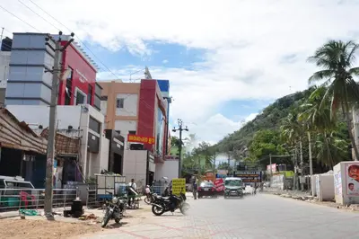 a city street with motorcycles parked on the street at Arunaachalaa Inn in Palani