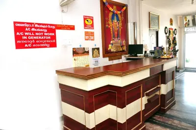 a bar in a room with a sign on the wall at Arunaachalaa Inn in Palani