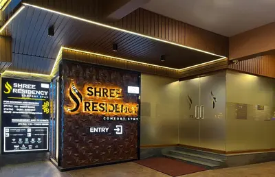 a entrance to a gym with a sign on the door at Shree Residency in Erode