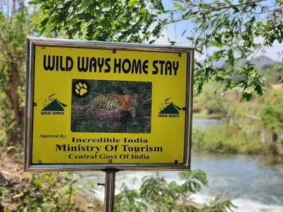 a yellow sign that reads wild ways home stay at Wildways Mudumalai Homestay in Masinagudi