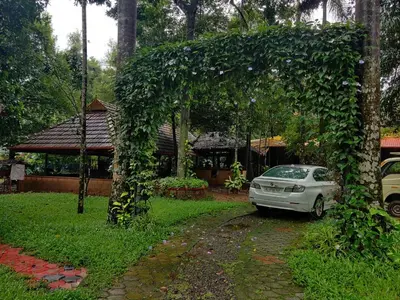 a car parked in front of a house at The Isle By Area 707 in Alwaye