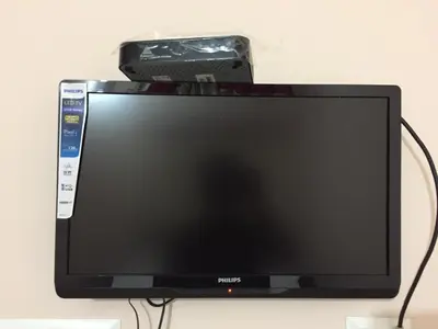 a computer monitor with a camera on top of it at Mega Tourist Home in Guruvāyūr
