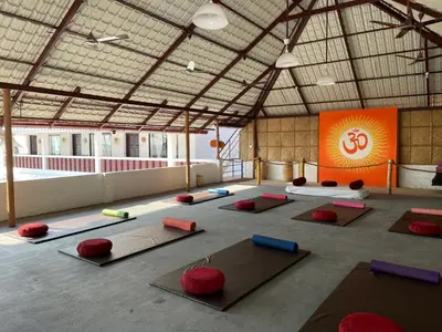 a large room with a lot of yoga mats at Veda5 Ayurveda Living Village in Trichūr