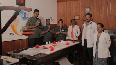 a group of people standing next to a table with food at Veda5 Ayurveda Living Village in Trichūr