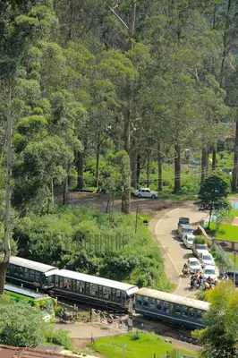 a group of buses parked in a parking lot at Skylarc Inn in Ooty