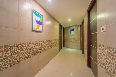 a corridor of a building with a hallway at Treebo Venition Inn in Coimbatore