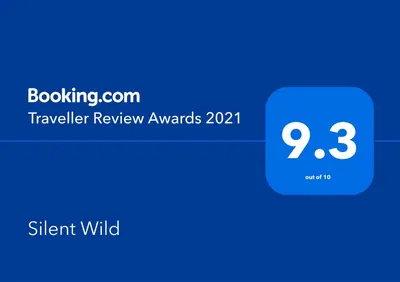 a screenshot of a cell phone with the travel review awards at Silent Wild in Masinagudi