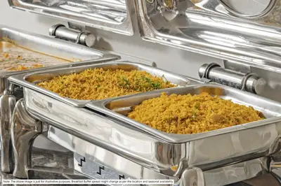 two metal trays of food in a buffet at Itsy Hotels Jammabane Cottage, 5 Minutes To Mountain View Coffee Plantation in Madikeri