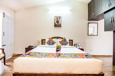 a bedroom with a large bed in a room at Via St Clouds - Nr Government Botanical Garden in Ooty