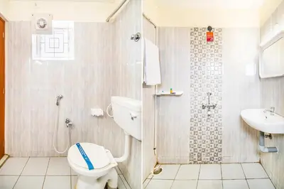 a bathroom with a toilet and a sink at FabHotel Thejas Paaradise - Nr Coimbatore Institute of Technology in Coimbatore