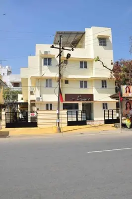 a large white building on the side of a street at SK Residency Unit 2 in Coimbatore