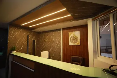 a kitchen with a counter top and a window at Haksons Residency in Mananthavady