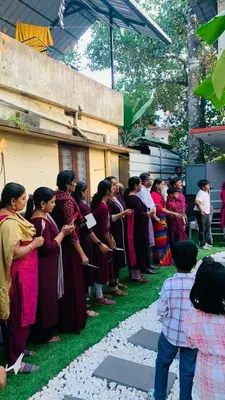 a group of people standing in front of a building at Krishnendu Homestay outer ring road north nada guruvayur in Guruvāyūr