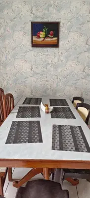 a table with four grids on top of it at Sugamya Corner Guesthouse in Mysore