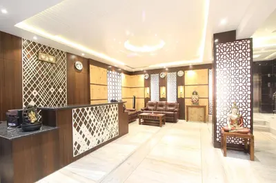 a lobby of a building with a waiting room at Sandesh Pride in Mysore