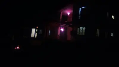 a night view of a building with lights in the dark at Holidays and Celebrations in Kodaikānāl