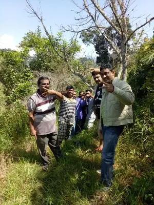 a group of men walking in the grass at Holidays and Celebrations in Kodaikānāl