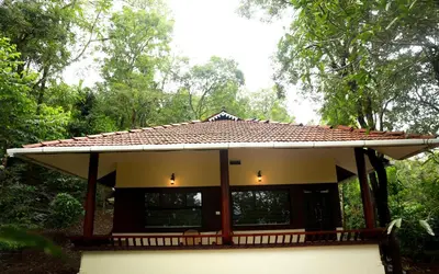 a small house with a tiled roof at Green Garden Wayanad Villas in Vayittiri