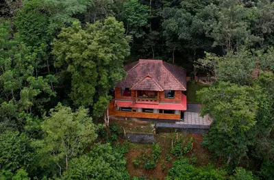 an overhead view of a house in the middle of a forest at Green Garden Wayanad Villas in Vayittiri