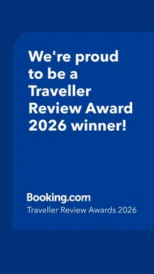 a blue sign that says were proud to be a traveller reviewagency winner at Royal Woods Coorg in Madikeri