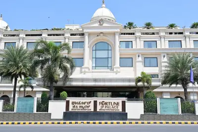 a white building with a sign in front of it at Fortune JP Palace, Mysore - Member ITC Hotels' Group in Mysore