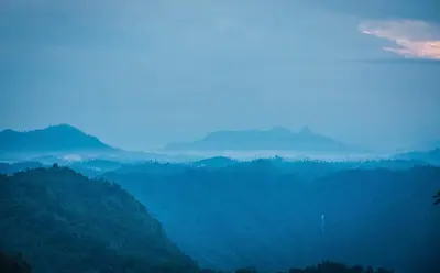 a view of a valley with mountains in the background at After the Rains - Rainforest Lodge in Meppādi