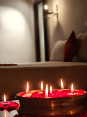 a group of lit candles in a room at Lakefront Beach Homes in Cherai Beach