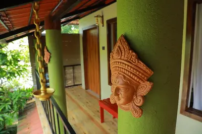 a decoration on the side of a house at Lakefront Beach Homes in Cherai Beach