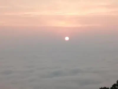 an image of the moon in the sky at sunset at Kalidasa Tree House and Villa, Wayanad in Chekadi