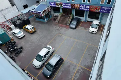 an overhead view of cars parked in a parking lot at Sri Aarvee Hotels in Coimbatore