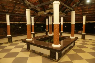 a row of columns in a room with a tiled floor at Mi Casa Tu Casa Homestay in Cochin