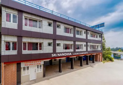 an external view of the sani mandapa university conference building at Sri Nandha Luxury Comforts in Vālpārai