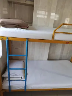 a pair of bunk beds in a room at vrs dormitary in Mysore