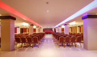 a room with rows of chairs and lights at Hotel Park Residency in Nilambūr