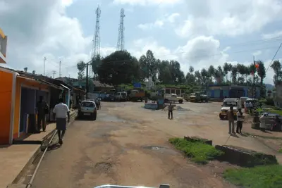 a group of people standing on a dirt road at Relaxing 2 B/R Estate House, Deenaty, Tamil Nadu in Coimbatore