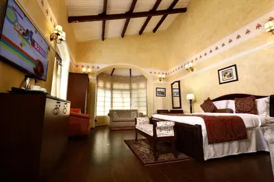 a bedroom with a large bed in a room at 7 BHK Luxury Heritage Villa - Rock Ooty in Ooty
