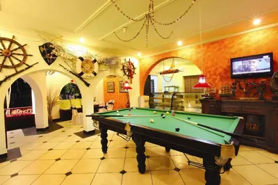 a billiard room with a pool table in it at Emarald Resort in Pulamanthole